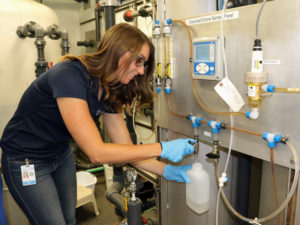 Lydia Peri, the Emerging Resources Program Administrator for the Truckee Meadows Water Authority, takes a sample for the OneWater Nevada Initiative.